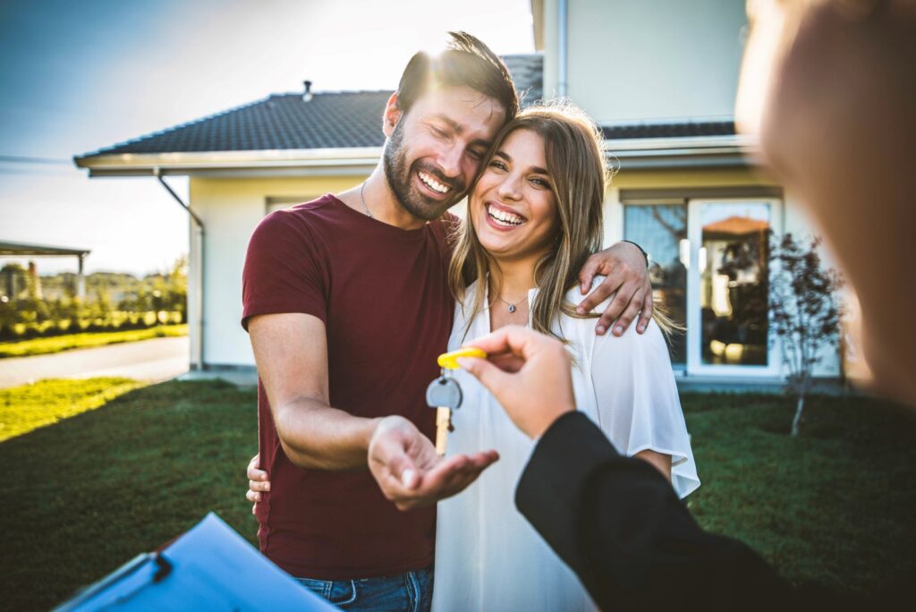 young couple buys house