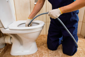 How to retrieve objects from a clogged toilet