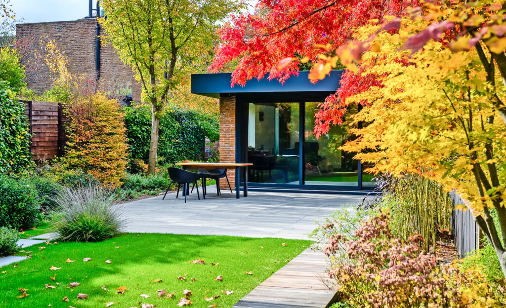 garden with naturalistic design yard hard landscaping, retreat house at autumn