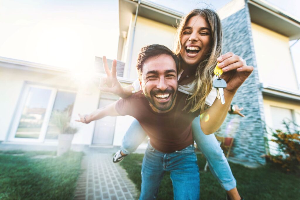 young couple buy first house